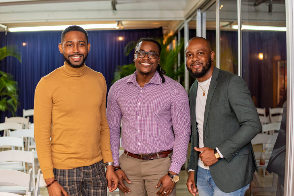 Then gents were not to be left out from the book launch proceedings. Alex Sterling (right), the Executive Liaison to Dr. Terri-Karelle Reid is joined by Communications specialist Dike Noel (left) and Banker Andre Muir (centre). 