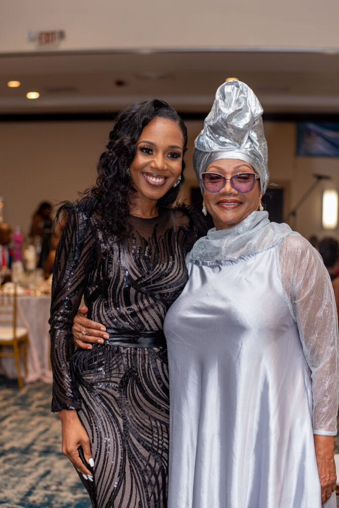 Distinguished awardee for Media and Communications, Dr. Terri-Karelle Reid, captures a moment with Marcia Griffiths, Queen of Reggae and newly minted Disnguished Pioneer Awardee in Entertainment.